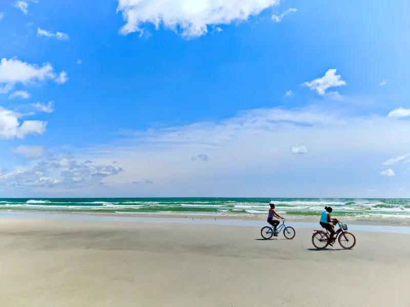 Girls Riding E Bikes on Butler Beach Saint Augustine Florida